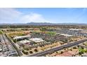 Expansive aerial shot showcasing a new community against a mountain backdrop at 37166 N El Morro Trl, San Tan Valley, AZ 85140