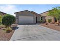 Single-story home with a two-car garage and well-maintained gravel front yard at 37166 N El Morro Trl, San Tan Valley, AZ 85140