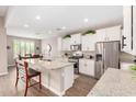 Beautiful kitchen with granite countertops, stainless steel appliances, and ample cabinet space at 37456 W Vera Cruz Dr, Maricopa, AZ 85138