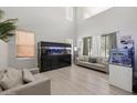 Bright living room featuring neutral decor and a large aquarium at 4118 N 304Th Ln, Buckeye, AZ 85396