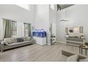 Bright living room with high ceilings, neutral decor, and a large aquarium at 4118 N 304Th Ln, Buckeye, AZ 85396