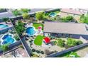 Aerial shot highlighting a backyard featuring a pool, outdoor seating, lush grass and desert landscaping at 6731 S 37Th Dr, Phoenix, AZ 85041
