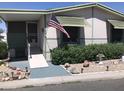 Inviting home exterior featuring an accessible ramp and charming, well-maintained landscaping at 6960 W Peoria Ave # 156, Peoria, AZ 85345