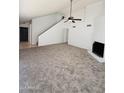 Spacious living room with new carpet, a fireplace, and easy access to the stairway at 708 N Country Club Way, Chandler, AZ 85226