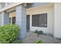 The well maintained townhouse features desert landscaping and a shaded porch at 7801 N 44Th Dr # 1036, Glendale, AZ 85301