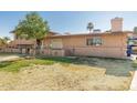 This single-Gathering home features a well maintained lawn with desert landscaping and a chimney at 840 N Acacia --, Mesa, AZ 85213