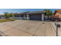 Charming single story home featuring a spacious driveway and a covered parking space at 845 E Hampton Ave, Mesa, AZ 85204