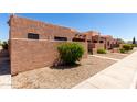 Attractive desert home boasts a stucco exterior, low-maintenance landscaping, and secure gated entrances for privacy at 8940 W Olive Ave # 59, Peoria, AZ 85345