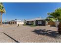 Street view of a charming single story home with low maintenance desert landscaping at 1527 W Roma Ave, Phoenix, AZ 85015