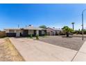 Single-Gathering home featuring a concrete driveway and low maintenance desert landscaping at 1527 W Roma Ave, Phoenix, AZ 85015