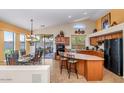 Open kitchen with an island, and a dining area, perfect for entertaining at 18089 W Weatherby Dr, Surprise, AZ 85374