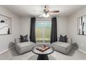 Cozy living room features contemporary decor, neutral color palette, and access to the outdoor patio at 19685 N Star Ridge Dr, Sun City West, AZ 85375