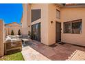 Inviting back patio with stone flooring and comfortable seating, perfect for outdoor relaxation at 2019 W Lemon Tree Pl # 1185, Chandler, AZ 85224