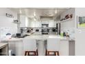 Stylish kitchen with granite countertops, white cabinets, and modern stainless steel appliances at 2019 W Lemon Tree Pl # 1185, Chandler, AZ 85224