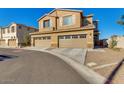 Inviting two-story home featuring a two-car garage and charming curb appeal with desert landscaping at 2254 E University Dr # 4, Mesa, AZ 85213