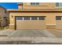Spacious two-car garage with brick accents and a well-maintained driveway at 2254 E University Dr # 4, Mesa, AZ 85213