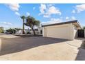 Single-story home featuring an attached garage and extra-long driveway, providing ample parking at 3218 W Clinton St, Phoenix, AZ 85029