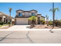 A charming two-story home with a three car garage complemented by mature palm trees in a manicured front yard at 3597 W Mineral Butte Dr, San Tan Valley, AZ 85144