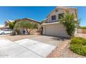 Two-story home featuring a white garage door and well-maintained landscape at 3821 W Barcelona Dr, Chandler, AZ 85226