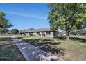 Well-manicured community showing lush lawns and sidewalk access to charming single story homes at 4752 N 20Th Ave, Phoenix, AZ 85015