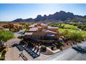 Beautiful community building with well manicured landscaping and golf course and mountain views at 5370 S Desert Dawn Dr # 56, Gold Canyon, AZ 85118