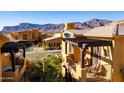 Exterior balcony view with mountain views and surrounding community homes and desert landscaping at 5370 S Desert Dawn Dr # 56, Gold Canyon, AZ 85118
