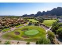 Expansive golf course view showcasing lush greens and the surrounding desert landscape and mountain views at 5370 S Desert Dawn Dr # 56, Gold Canyon, AZ 85118