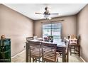 Cozy dining area with a large window and plenty of seating for Gathering and friends at 597 S 167Th Dr, Goodyear, AZ 85338