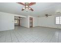 Spacious living room featuring tile floors and ceiling fans for added comfort at 829 E Echo Ln, Phoenix, AZ 85020
