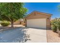 Well-maintained single-Gathering home with a spacious driveway and two-car garage, perfect for suburban living at 8319 E Portobello Ave, Mesa, AZ 85212