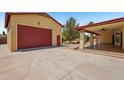 Three car garage and covered patio provides ample parking and outdoor space at 8511 W Via Montoya Dr, Peoria, AZ 85383