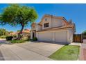 Charming two-story home showcasing a spacious three-car garage and landscaped surroundings at 18207 N 46Th St, Phoenix, AZ 85032
