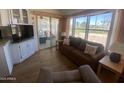 Open-concept space with living room, kitchen and access to the patio area at 2290 S Seminole Dr, Apache Junction, AZ 85119