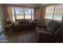 Inviting living room featuring comfortable seating and a large window with bright natural light at 2290 S Seminole Dr, Apache Junction, AZ 85119