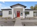 Close-up of the front of the home showcasing a red door, modern mailbox, and xeriscape landscaping at 2402 N 15Th St, Phoenix, AZ 85006