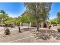 Beautiful desert home with a two-car garage, easy-care landscaping, and covered front entrance at 3228 W Saint Anne Ave, Phoenix, AZ 85041