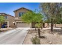 Inviting two-story home with a well-maintained front yard, featuring desert landscaping and a two-car garage at 3228 W Saint Anne Ave, Phoenix, AZ 85041