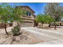 Well-kept two-story home with a two-car garage and low-maintenance desert landscaping for easy upkeep at 3228 W Saint Anne Ave, Phoenix, AZ 85041