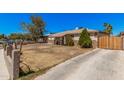 Street view of a single-story home with a stone accent facade and a mature tree at 4403 N 48Th Dr, Phoenix, AZ 85031