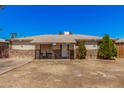 Charming single-story home featuring a stone accent facade and tidy front yard at 4403 N 48Th Dr, Phoenix, AZ 85031