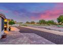 Expansive back patio overlooks the community golf course and desert landscaping at 8061 E Lavender Dr, Gold Canyon, AZ 85118