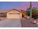 Charming single-Gathering home featuring a two-car garage, desert landscaping, and mature Saguaro cactus at 8061 E Lavender Dr, Gold Canyon, AZ 85118
