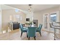 Spacious living room featuring a fireplace, dining area with chairs, and lots of natural light at 154 W 5Th St # 246, Tempe, AZ 85281