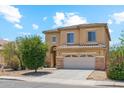 Charming two-story home with a tile roof, attached two-car garage, and desert landscaping at 1753 N St Francis Pl, Casa Grande, AZ 85122