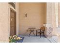 Inviting front porch with seating area, decorative lighting, and neutral color scheme at 1753 N St Francis Pl, Casa Grande, AZ 85122