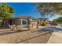 Beautiful exterior showcasing stone accents, a tile roof, and desert landscaping at 20919 E Desert Hills Blvd, Queen Creek, AZ 85142