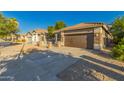 Well-maintained home with a tile roof, neutral colors, and an attached two-car garage at 20919 E Desert Hills Blvd, Queen Creek, AZ 85142