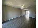 Spacious open-concept living room with neutral paint, ceiling fan, recessed lighting, and modern tile flooring at 3935 E Rough Rider Rd # 1282, Phoenix, AZ 85050