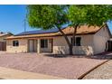 Charming single-story home featuring a low maintenance yard and solar panels at 4134 W Camino Acequia --, Phoenix, AZ 85051