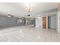 Spacious living room with tile floors, ceiling fans, and lots of natural light at 4553 N 54Th Ave, Phoenix, AZ 85031